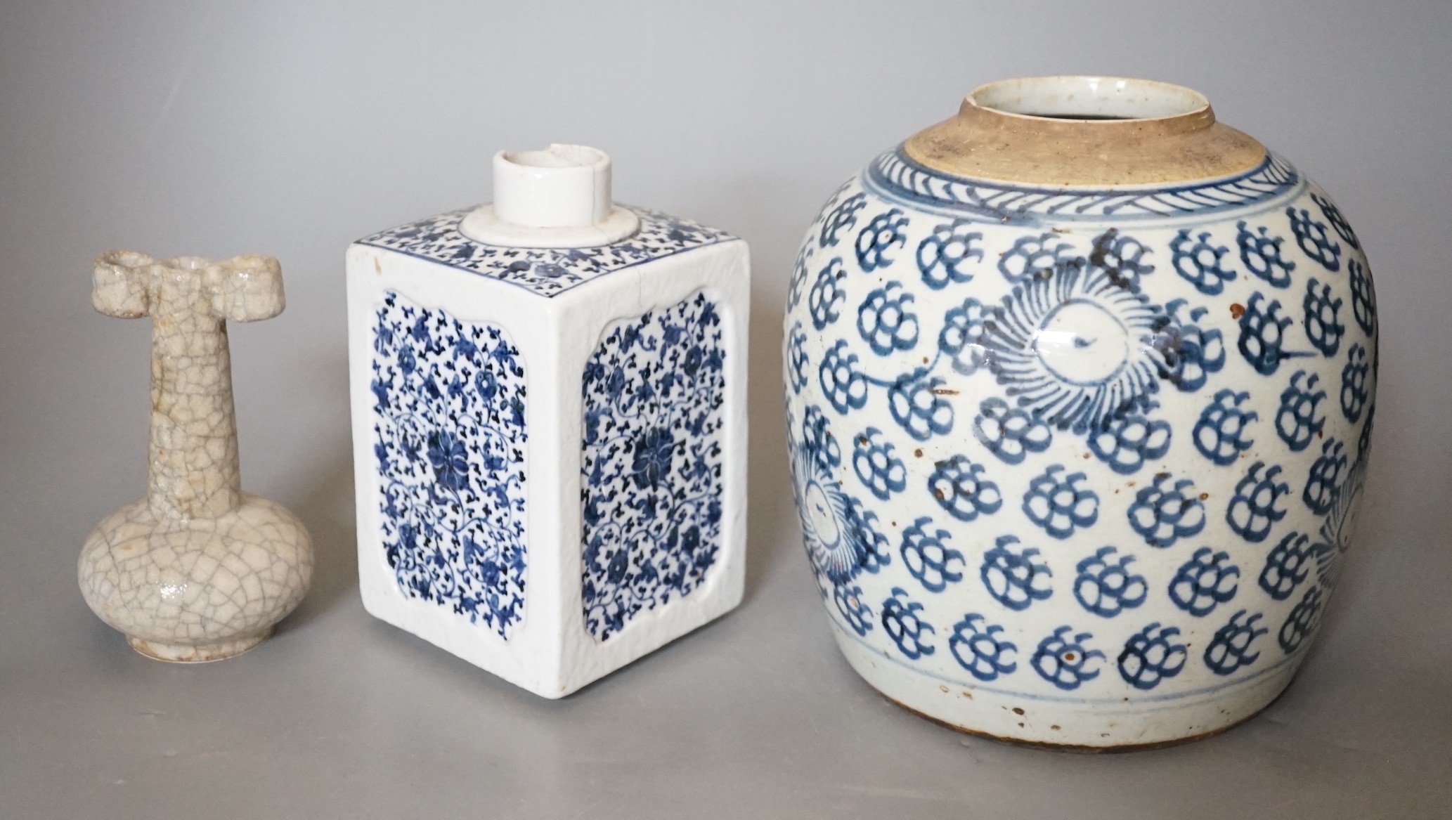 An 18th century Chinese provincial jar together with a tea canister and crackleglaze vase, tallest 18.5cm